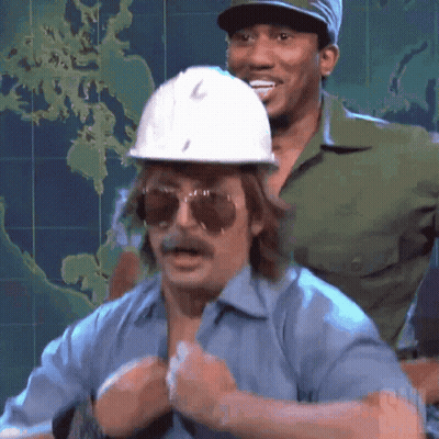 A Man Wearing A Hard Hat And Sunglasses Stands Next To Another Man GIF