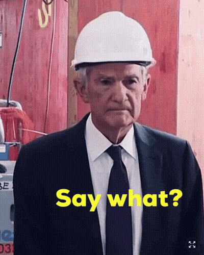 A Man Wearing A Hard Hat Says Say What GIF