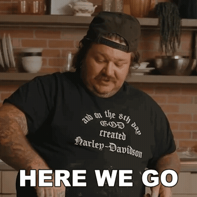 A Man Wearing A Harley Davidson T-Shirt Says " Here We Go " GIF