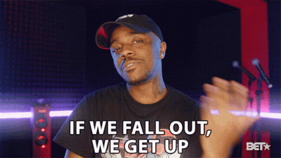 A Man Wearing A Hat And A Black Shirt Says If We Fall Out We Get Up GIF