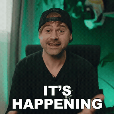 A Man Wearing A Hat And A Black Shirt Says It 'S Happening GIF
