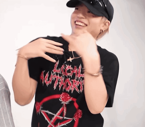 A Man Wearing A Hat And A Black T-Shirt With A Pentagram On It GIF