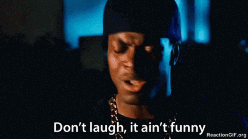 A Man Wearing A Hat And A Chain Says " Don 'T Laugh It Ain 'T Funny " GIF