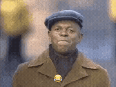 A Man Wearing A Hat And A Coat Is Laughing With A Tear Coming Out Of His Eye . GIF