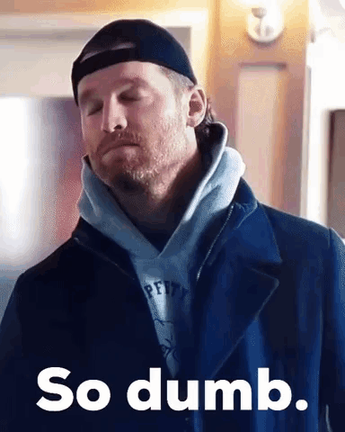 A Man Wearing A Hat And A Coat Is Making A Funny Face And Saying `` So Dumb '' . GIF