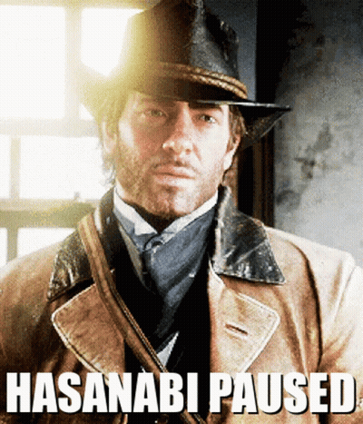 A Man Wearing A Hat And A Coat With The Words Hasanabi Paused Written Below Him GIF