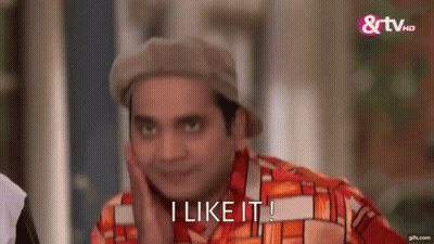 A Man Wearing A Hat And A Colorful Shirt Is Making A Funny Face And Saying `` I Like It '' . GIF