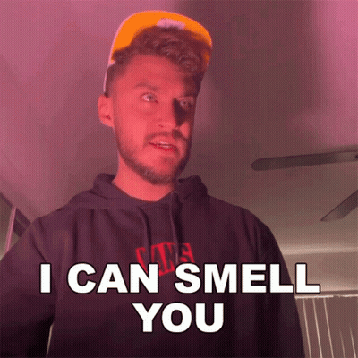 A Man Wearing A Hat And A Hoodie Says " I Can Smell You " GIF