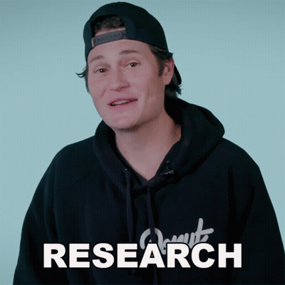 A Man Wearing A Hat And A Hoodie With The Word Research Written On It GIF