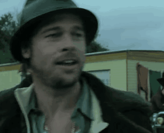 A Man Wearing A Hat And A Jacket Is Talking GIF