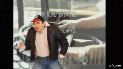 A Man Wearing A Hat And A Leather Jacket Is Dancing In Front Of A Sign That Says ' A ' On It GIF