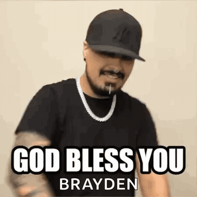 A Man Wearing A Hat And A Necklace Is Making A Funny Face And Saying `` God Bless You Brayden '' . GIF
