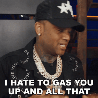 a man wearing a hat and a necklace is saying i hate to gas you up and all that