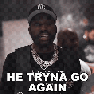 A Man Wearing A Hat And A Necklace Says " He Tryna Go Again " GIF