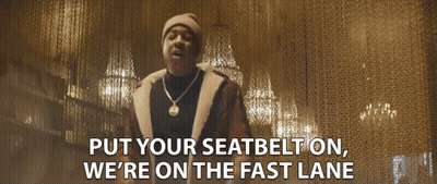A Man Wearing A Hat And A Necklace Says Put Your Seatbelt On We 'Re On The Fast Lane GIF