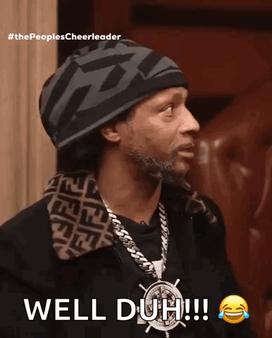 A Man Wearing A Hat And A Necklace Says Well Duh ! GIF