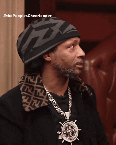 A Man Wearing A Hat And A Necklace With The Words #Thepeoplescheerleader GIF