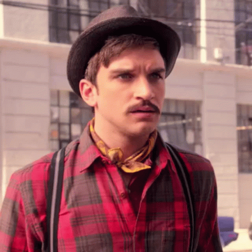A Man Wearing A Hat And A Plaid Shirt GIF