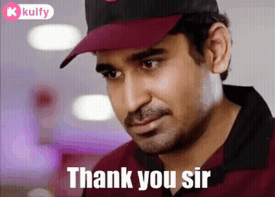 A Man Wearing A Hat And A Red Shirt Is Saying Thank You Sir . GIF