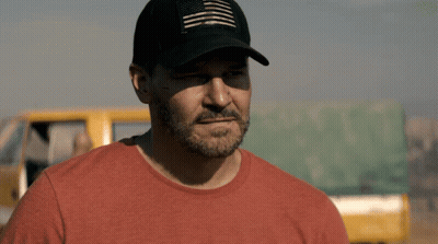 A Man Wearing A Hat And A Red Shirt GIF