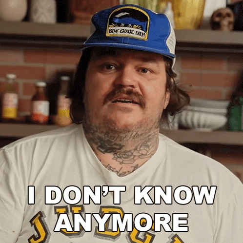 A Man Wearing A Hat And A Shirt That Says I Don T Know Anymore GIF