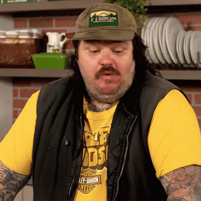 A Man Wearing A Hat And A Shirt That Says Ley-Davidson GIF