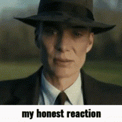 A Man Wearing A Hat And A Suit With The Words My Honest Reaction Below Him GIF