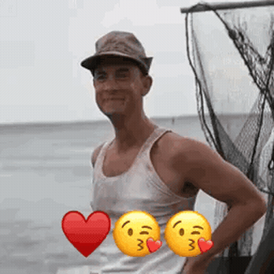 A Man Wearing A Hat And A Tank Top Is Standing In Front Of A Fishing Net With Two Smiley Faces . GIF