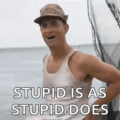 A Man Wearing A Hat And A Tank Top Is Standing On A Boat In The Ocean . GIF