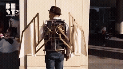 A Man Wearing A Hat And A Vest That Says Be Stz Products GIF