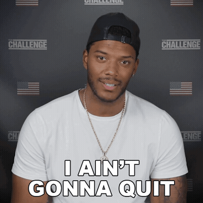 a man wearing a hat and a white shirt says " i ain 't gonna quit "