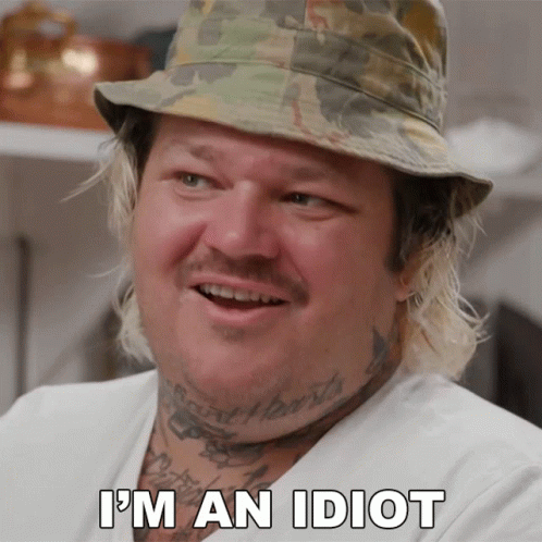 A Man Wearing A Hat And A White Shirt Says " I 'M An Idiot " GIF
