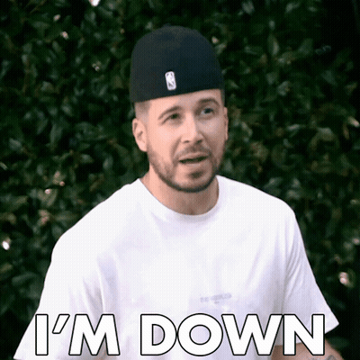 A Man Wearing A Hat And A White Shirt Says I 'M Down . GIF