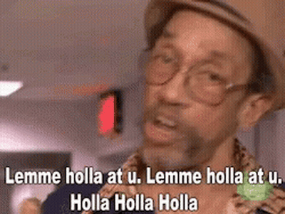 A Man Wearing A Hat And Glasses Is Making A Funny Face And Saying Lemme Holla At U. GIF