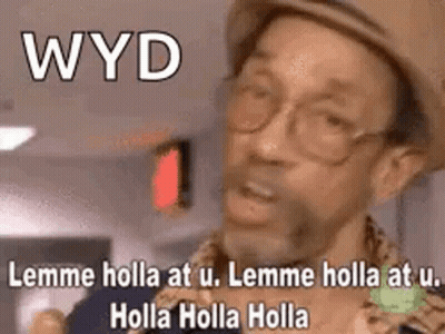 A Man Wearing A Hat And Glasses Is Making A Funny Face While Talking . GIF