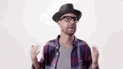 A Man Wearing A Hat And Glasses Is Talking To Someone . GIF