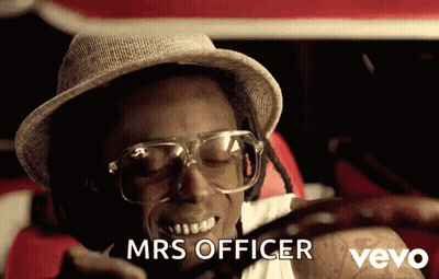 A Man Wearing A Hat And Glasses Says Mrs Officer On A Cell Phone GIF