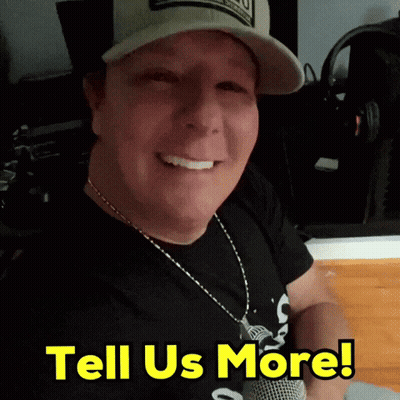 A Man Wearing A Hat And Necklace Says Tell Us More In Yellow Letters GIF