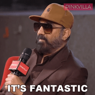 A Man Wearing A Hat And Sunglasses Holds A Microphone And Says " It 'S Fantastic " GIF