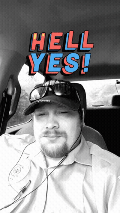 A Man Wearing A Hat And Sunglasses Is Sitting In A Car With The Words Hell Yes Behind Him GIF