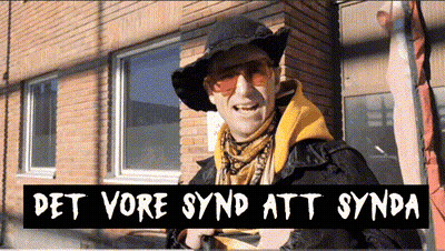 A Man Wearing A Hat And Sunglasses Is Standing In Front Of A Brick Building With The Words Det Vore Synd Att Synda Above GIF