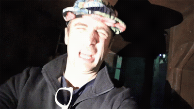 A Man Wearing A Hat And Sunglasses Making A Face GIF