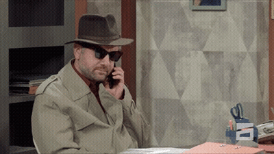 A Man Wearing A Hat And Sunglasses Talking On A Cell Phone GIF