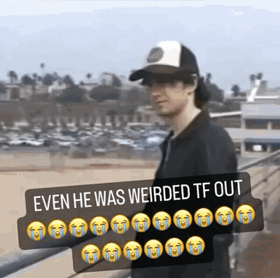 A Man Wearing A Hat Is Standing On A Bridge With A Caption That Says Even He Was Weirded Tf Out . GIF