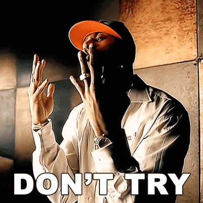 A Man Wearing A Hat Says " Do N't Try " With His Hands In The Air GIF