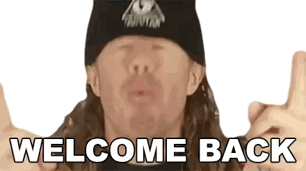 A Man Wearing A Hat Says Welcome Back With His Fingers Up Sticker