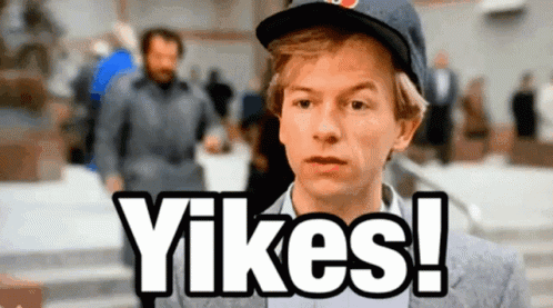 A Man Wearing A Hat Says " Yikes " In Front Of Him GIF
