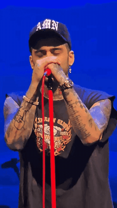 A Man Wearing A Hat That Says Amn On It GIF