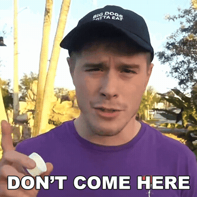 A Man Wearing A Hat That Says Big Dogs Only Eat Holds A Marshmallow And Says " Don 'T Come Here " GIF