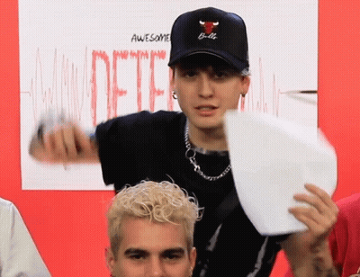 A Man Wearing A Hat That Says Bulls On It GIF